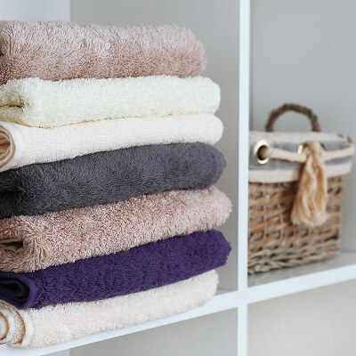 Towels folded and stacked on a shelf