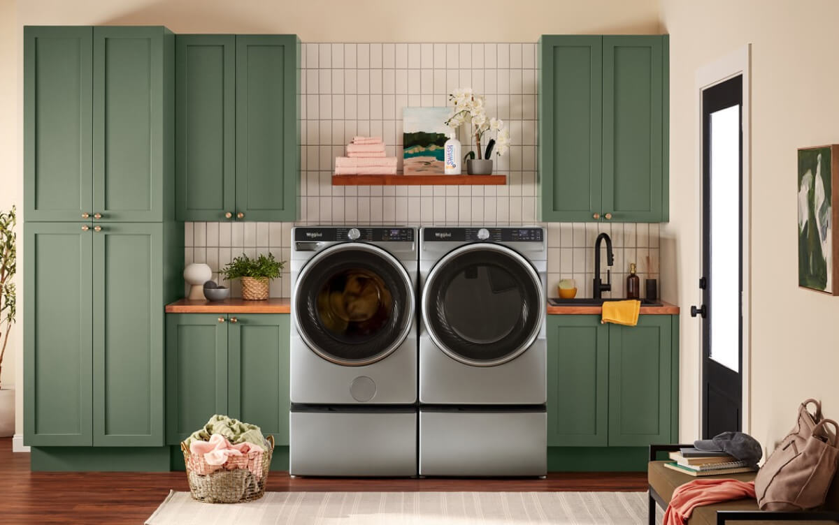 A laundry room with a front load washer and dryer pair