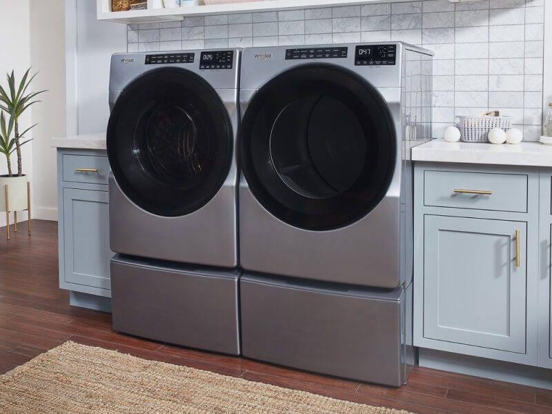 Gray Whirlpool®  Front Load Washer and Dryer placed side by side
