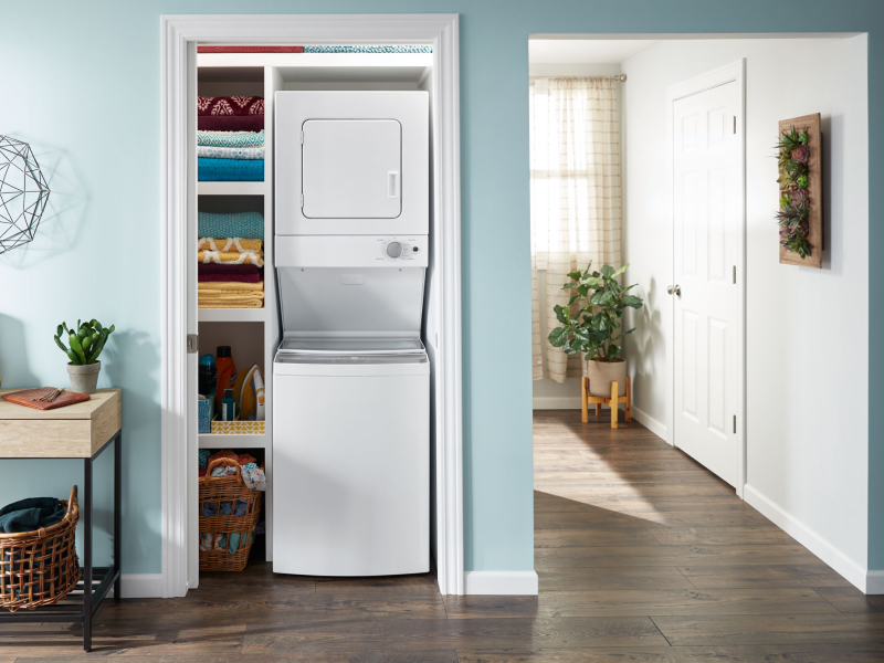 Stacked laundry center in a closet