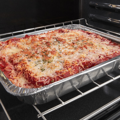 Cheesy pasta baking in oven