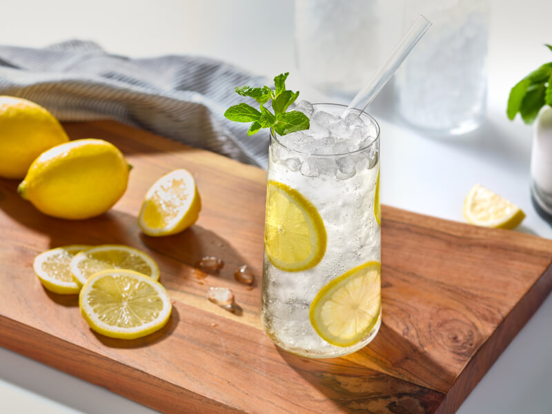 Lemon water in a glass with nugget ice