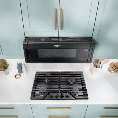 Whirlpool® Over-the-Range Microwave in light blue cabinetry
