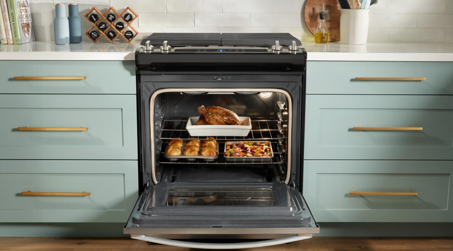 Whirlpool® oven open to show food on multiple racks Whirlpool® oven open to show food on multiple racks