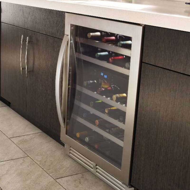 A Whirlpool® Undercounter Wine Refrigerator stocked with wine bottles