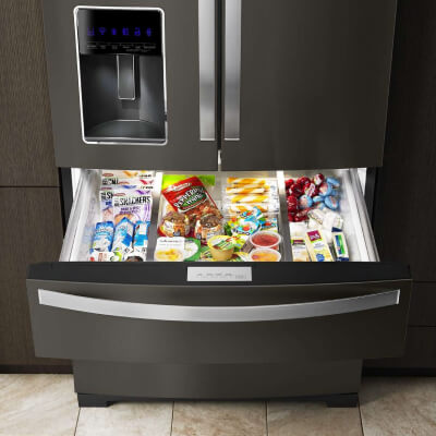Whirlpool® Refrigerator with exterior drawer pulled out and full of food