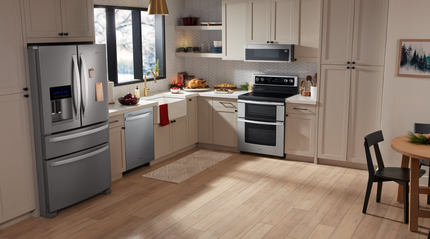 A bright kitchen with white counters and stainless steel Whirlpool® Appliances