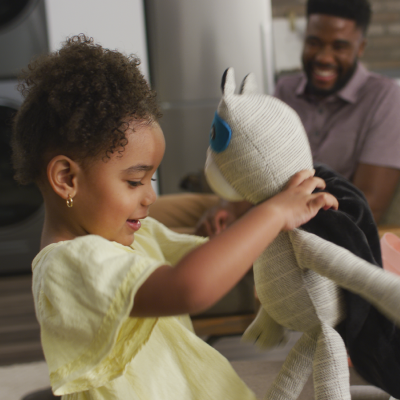 Child playing with stuffed toy