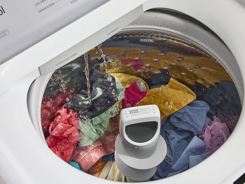 Water running into a Whirlpool® Washing Machine with a 2-in-1 Removable Agitator