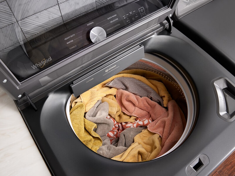 Overhead view of a load of rags and towels in a washing machine