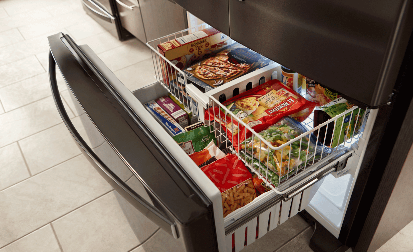 Bottom freezer open to show contents 