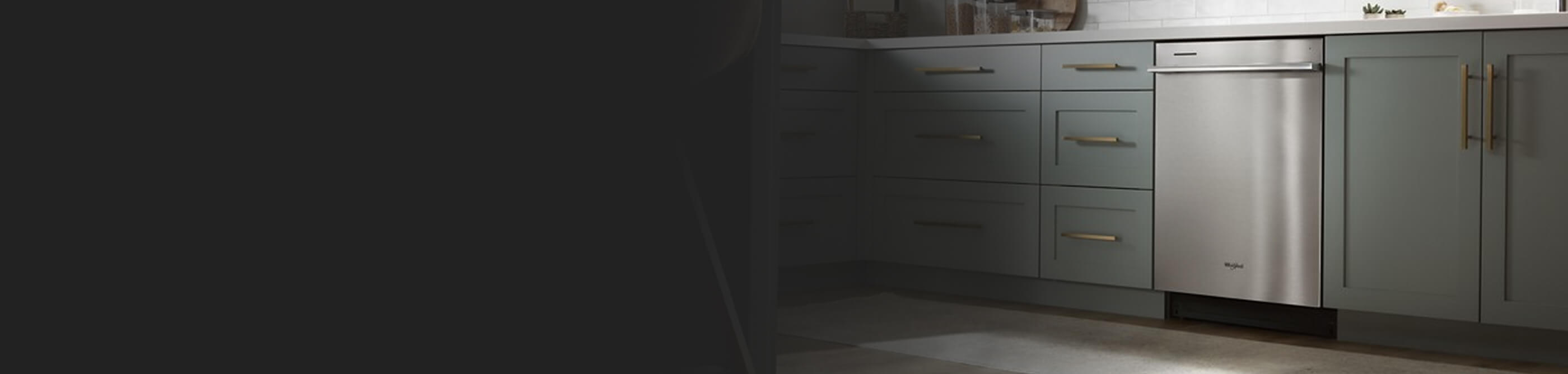 Whirlpool® Dishwasher set in light green cabinetry