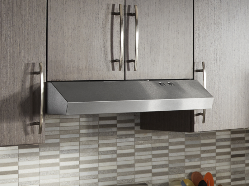 Undercabinet hood installed beneath modern wood cabinets Undercabinet hood installed beneath modern wood cabinets