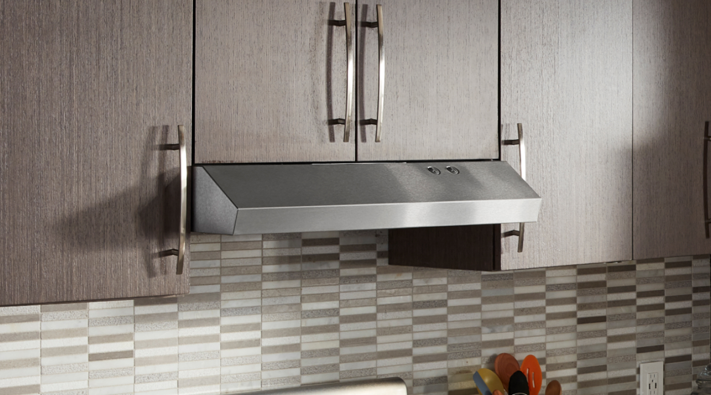 Undercabinet hood installed beneath modern wood cabinets Undercabinet hood installed beneath modern wood cabinets