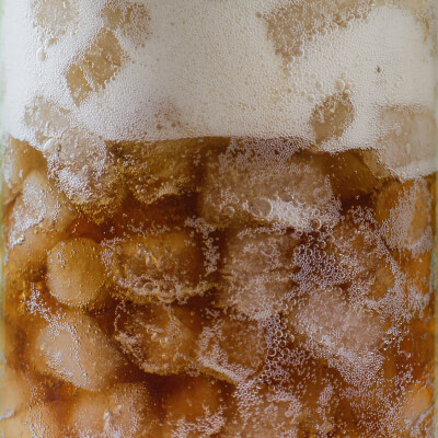 Glass full of soda and nugget ice