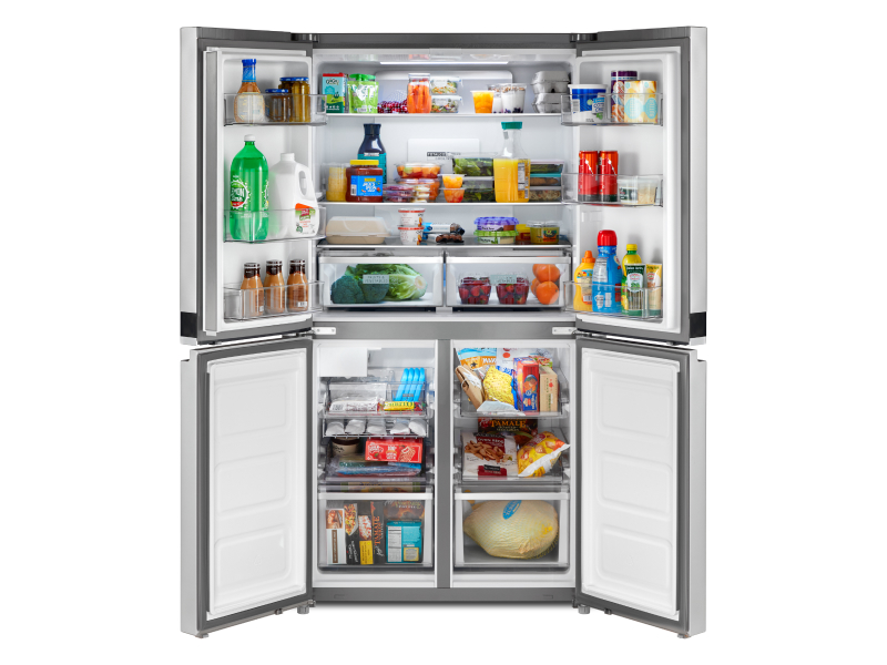 Four door refrigerator opened to show contents Four door refrigerator opened to show contents