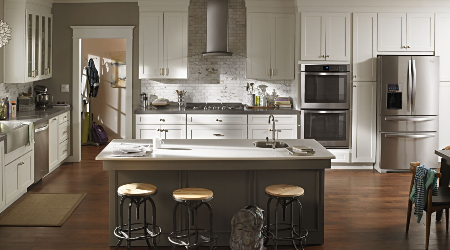 A wall mount range hood in a kitchen