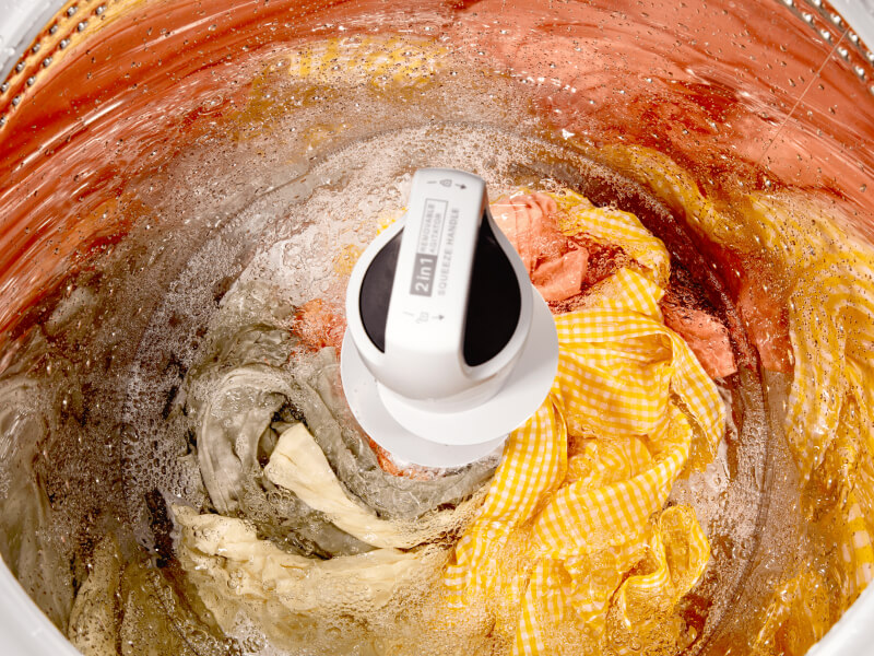 A close up of clothes in a Whirlpool® Top Load Washer with 2 in 1 Removable Agitator during a wash cycle A close up of clothes in a Whirlpool® Top Load Washer with 2 in 1 Removable Agitator during a wash cycle