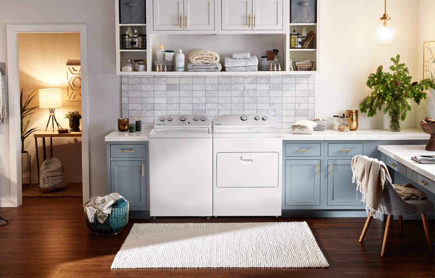 White side-by-side Whirlpool® Washer and Dryer in a modern laundry room