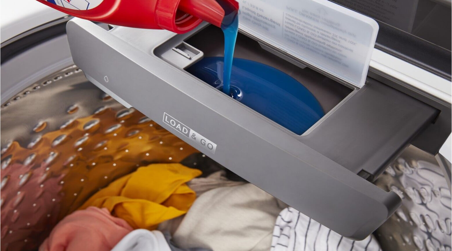 Laundry detergent being poured into a Whirlpool® Load & Go™ Dispenser
