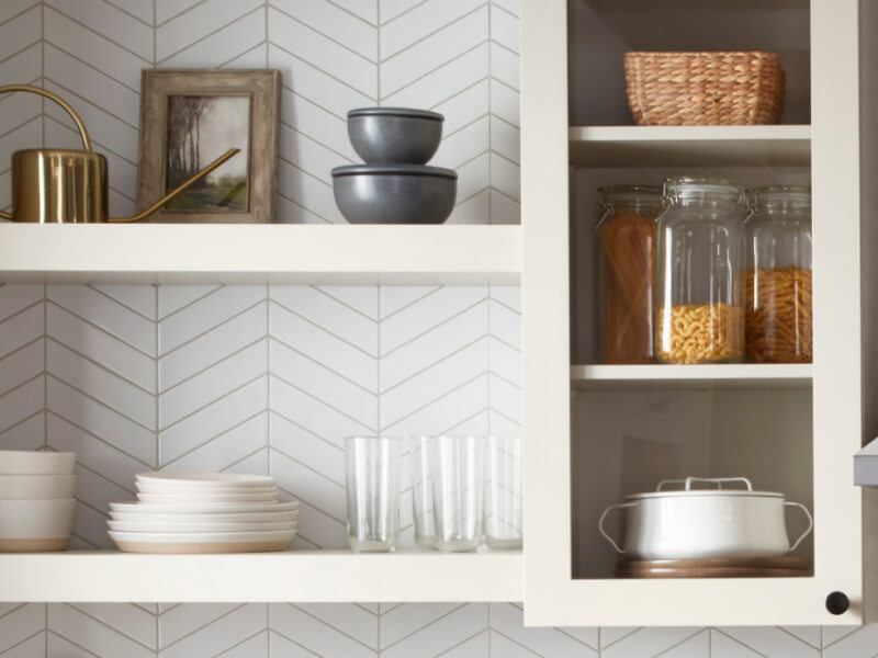 White shelves filled with dishes and glassware
