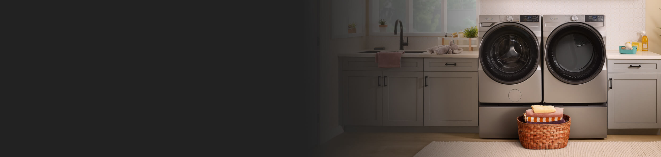 A Whirlpool® washer and dryer pair in a laundry room