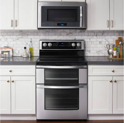 Double oven set in white cabinetry