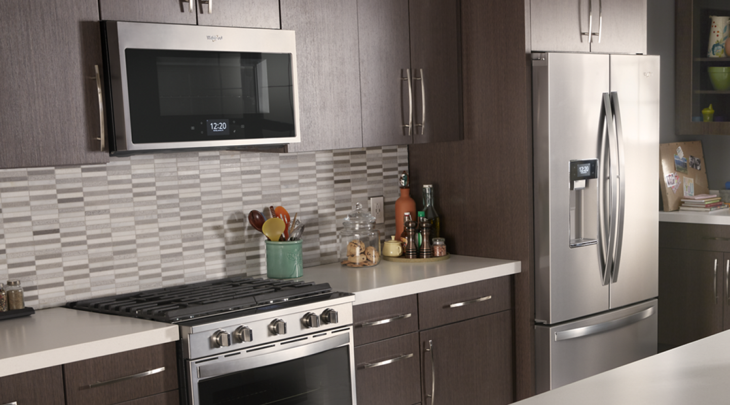Stainless steel Whirlpool® appliances in a modern kitchen