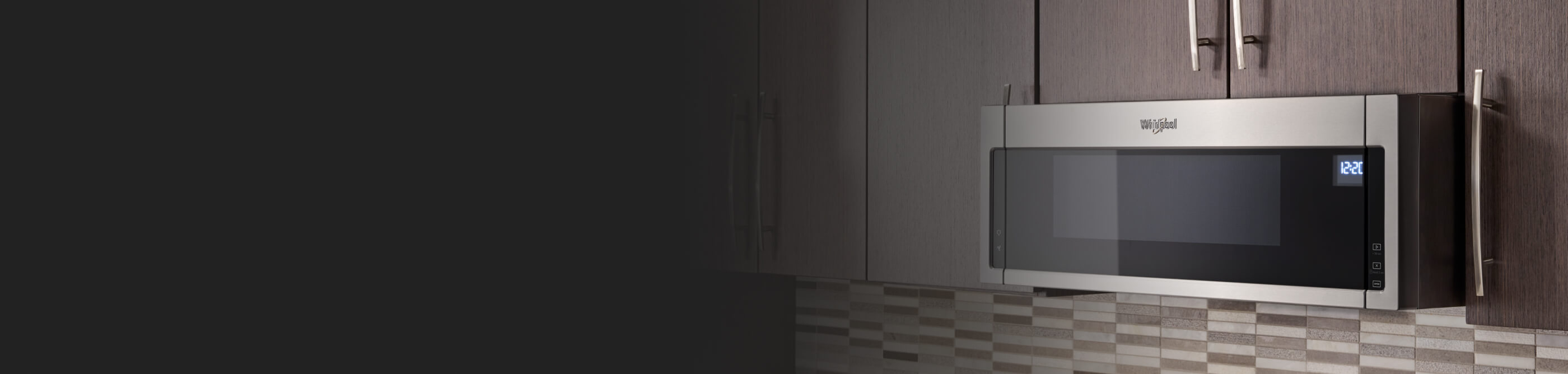 Stainless, Whirlpool® Over-The-Range Microwave in brown cabinetry