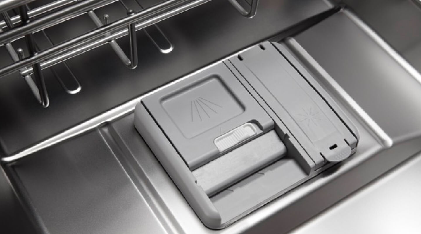 Close-up of a dishwasher detergent dispenser