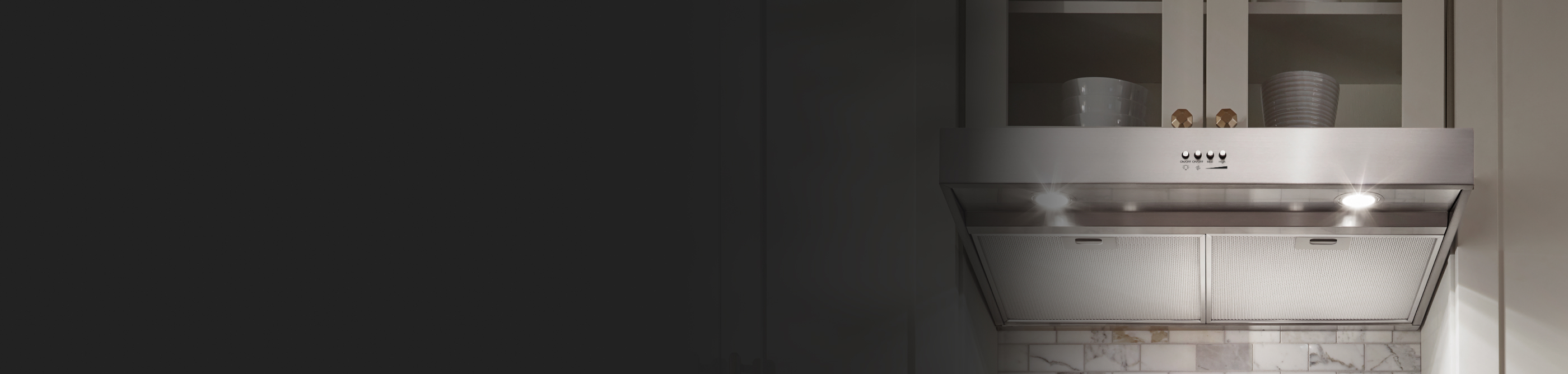 Stainless steel range hood under a cabinet