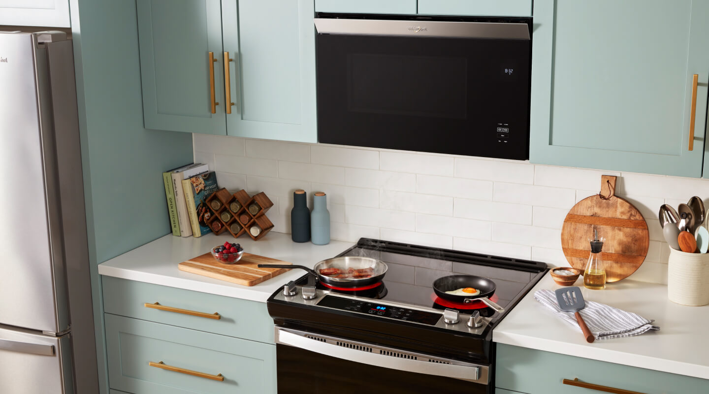 Microwave hood combination above an electric range