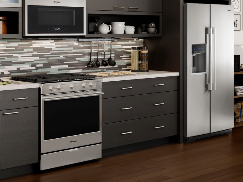 A Whirlpool® oven in a modern kitchen. A Whirlpool® oven in a modern kitchen.