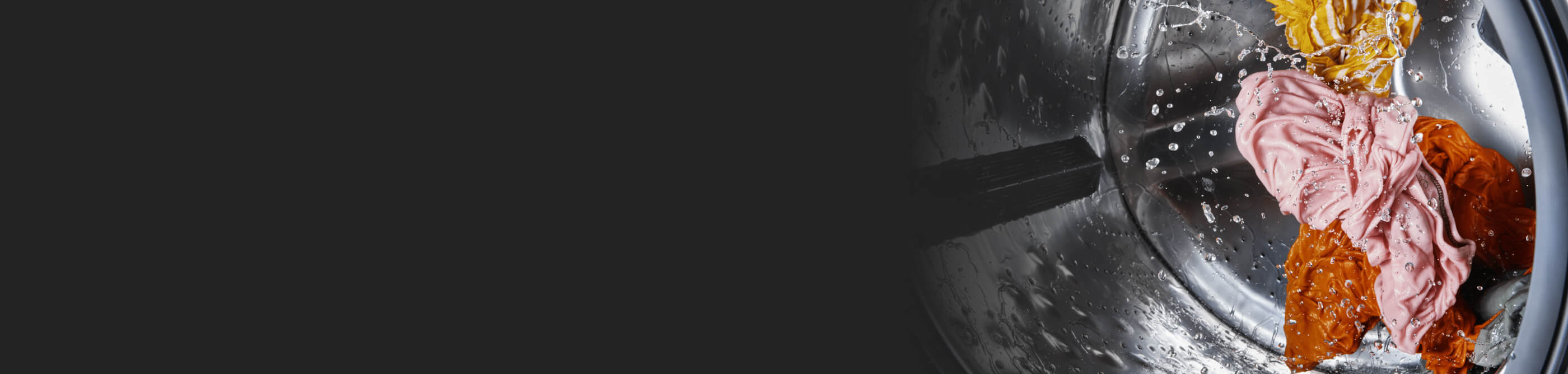 Bright clothes tumbling inside a front load washer