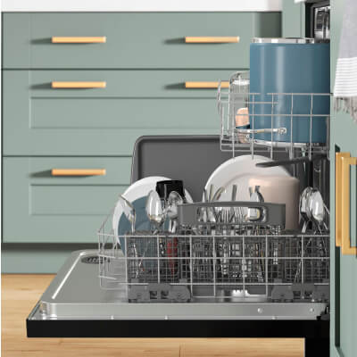 Open dishwasher filled with dishes and utensils