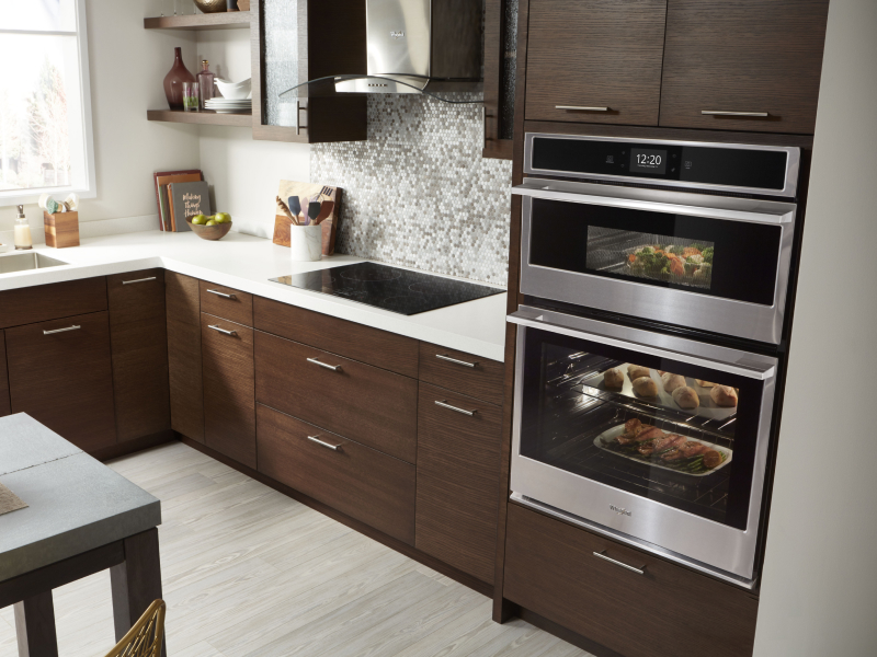 A double-wall oven cooking multiple dishes