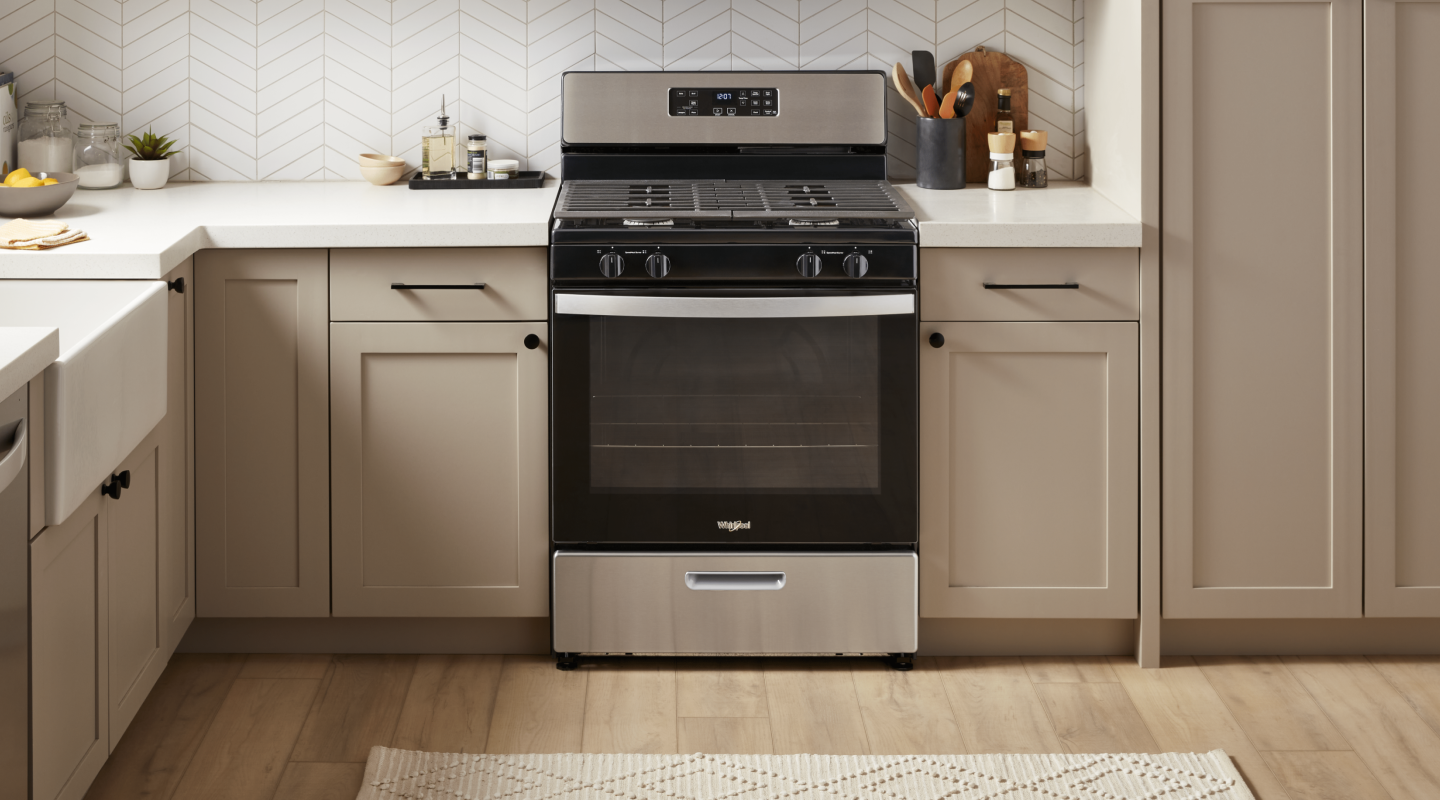 Whirlpool® oven in a light gray and light brown themed kitchen