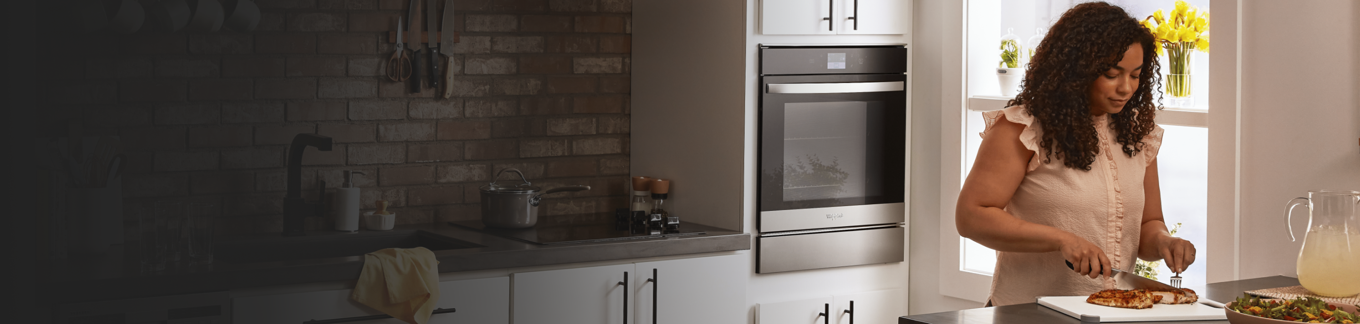 Person eating in a kitchen