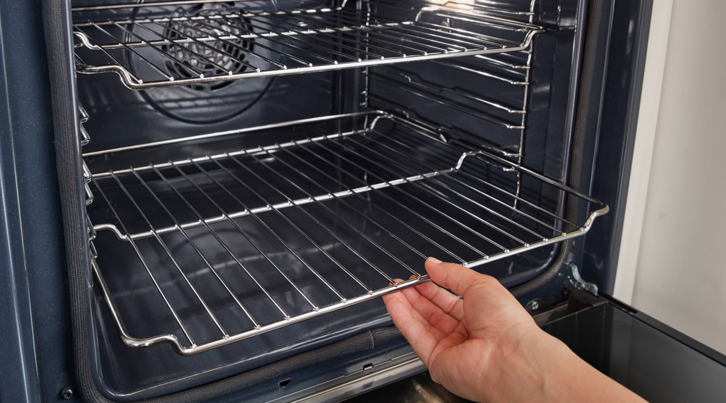 Person pulling out lower oven rack Person pulling out lower oven rack