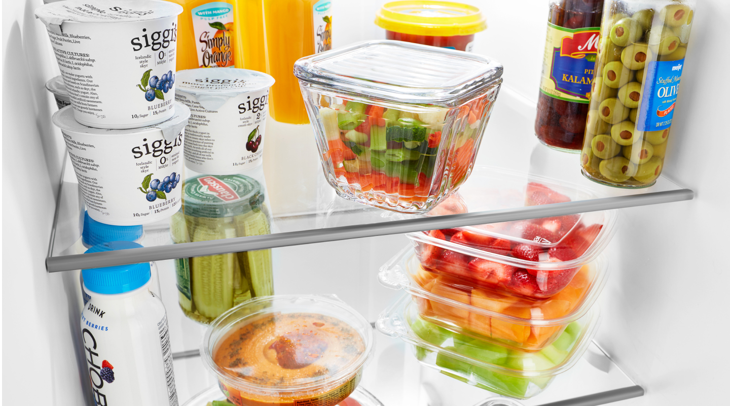 Stocked refrigerator shelves Stocked refrigerator shelves