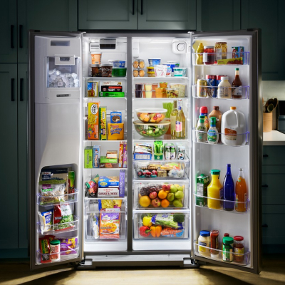 Open side-by-side refrigerator fully stocked with food