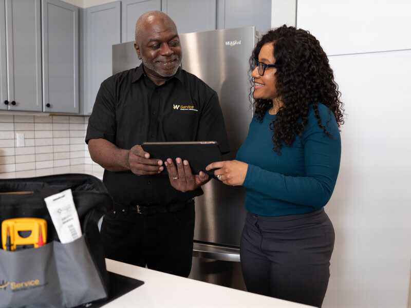 Person receiving service for a Whirlpool brand appliance