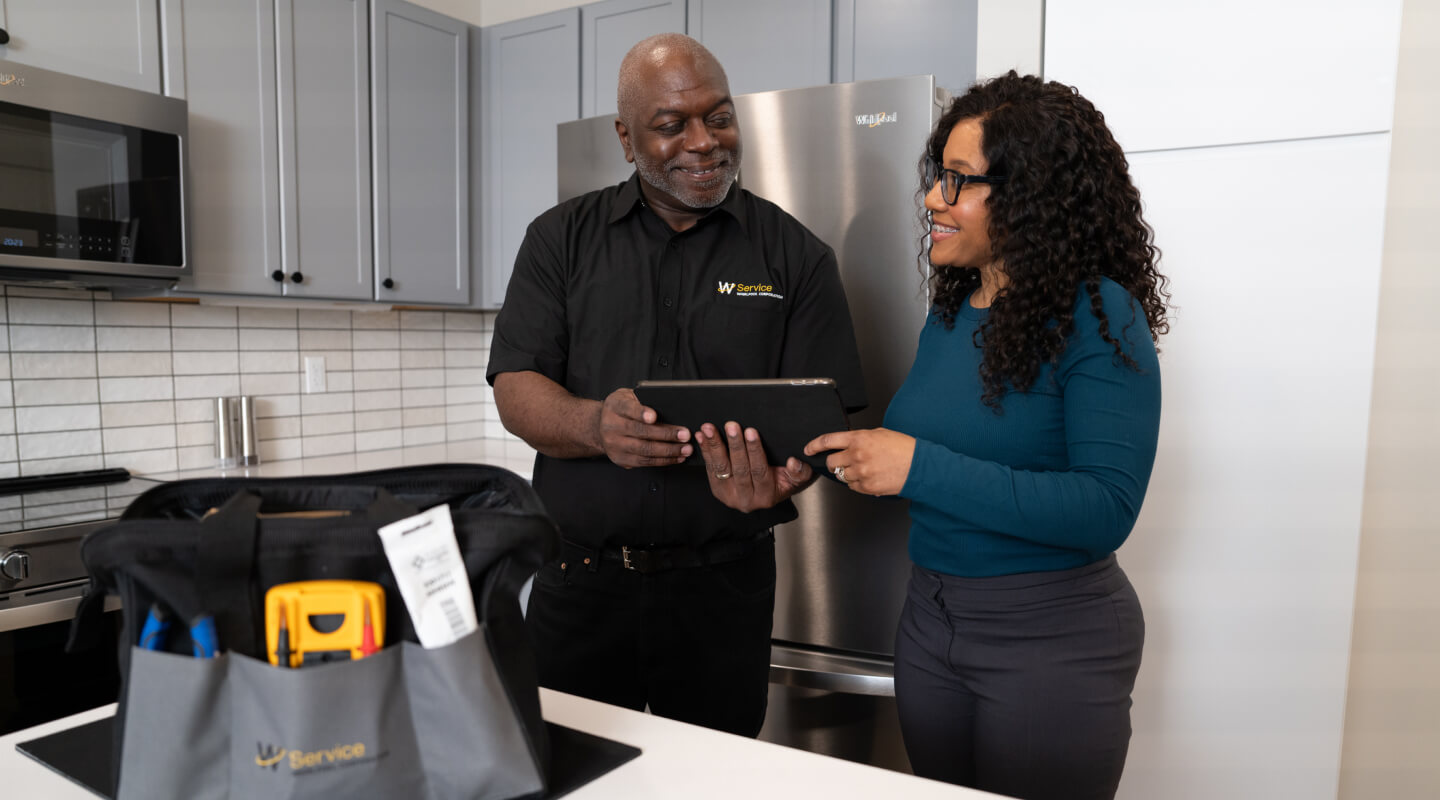 Person receiving service for a Whirlpool brand appliance