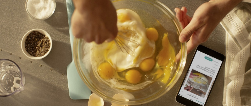 A person whisking eggs in a bowl