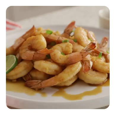 Shrimp with herbs in a light pink dish