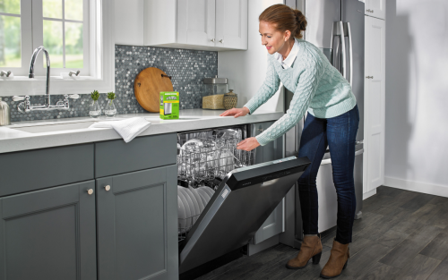 Person loading dishwasher