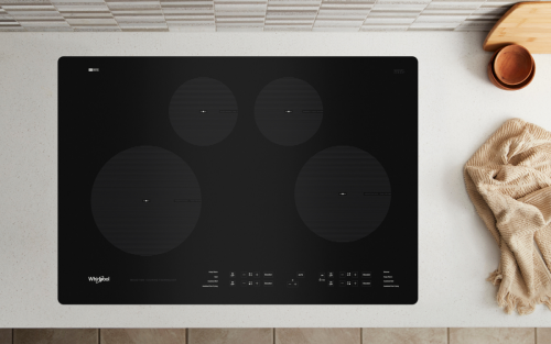 A black 4-burner cooktop