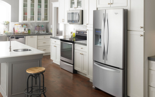 Stainless steel Whirlpool® French door refrigerator in white cabinetry