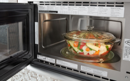 Glass bowl filled with vegetables in Whirlpool® microwave