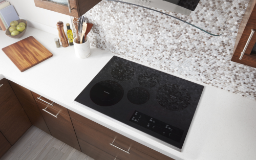 Top view image of cooktop set into white countertop